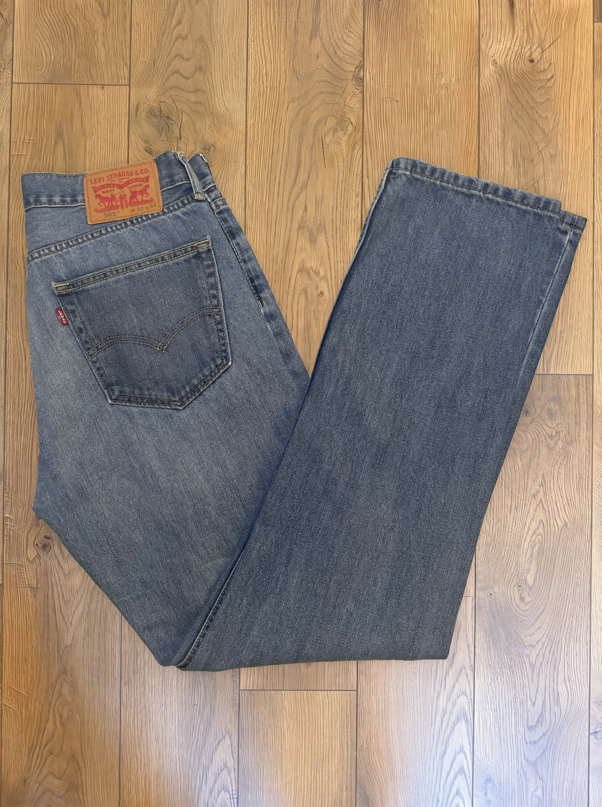 Vintage Levi's 505 jeans in faded mid wash — folded