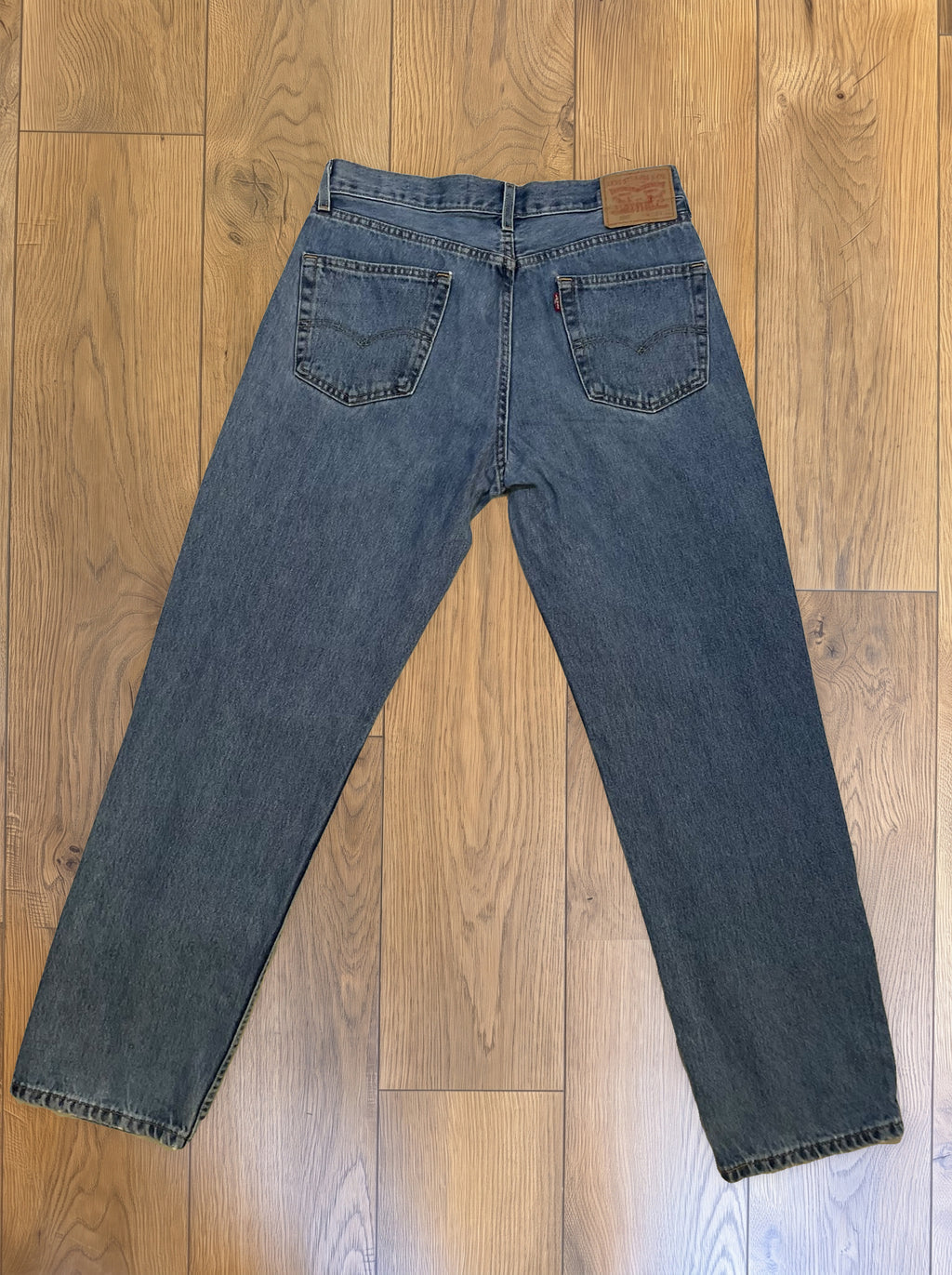 Vintage Levi's 550 jeans in medium wash — detail