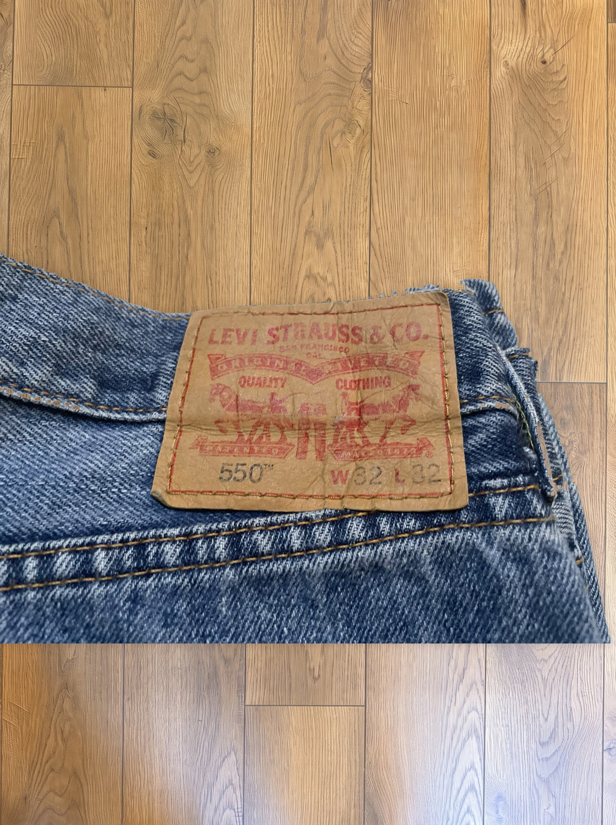 Vintage Levi's 550 jeans in medium wash — detail