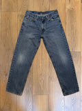 Vintage Levi's 550 jeans in distressed mid wash — detail