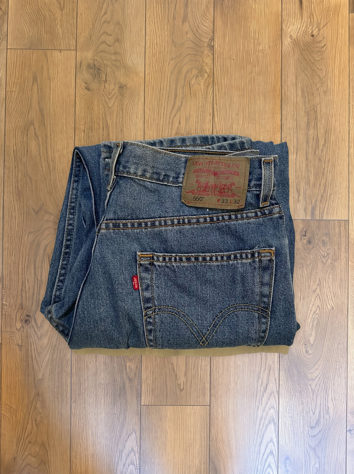 Vintage Levi's 550 jeans in medium wash — folded