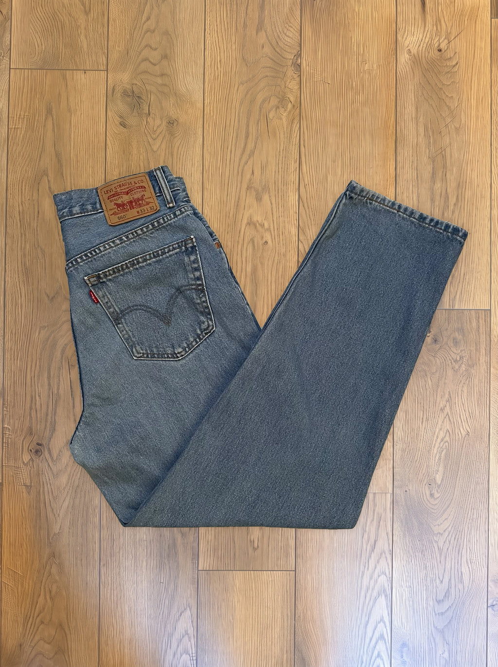 Vintage Levi's 560 jeans in light wash — folded
