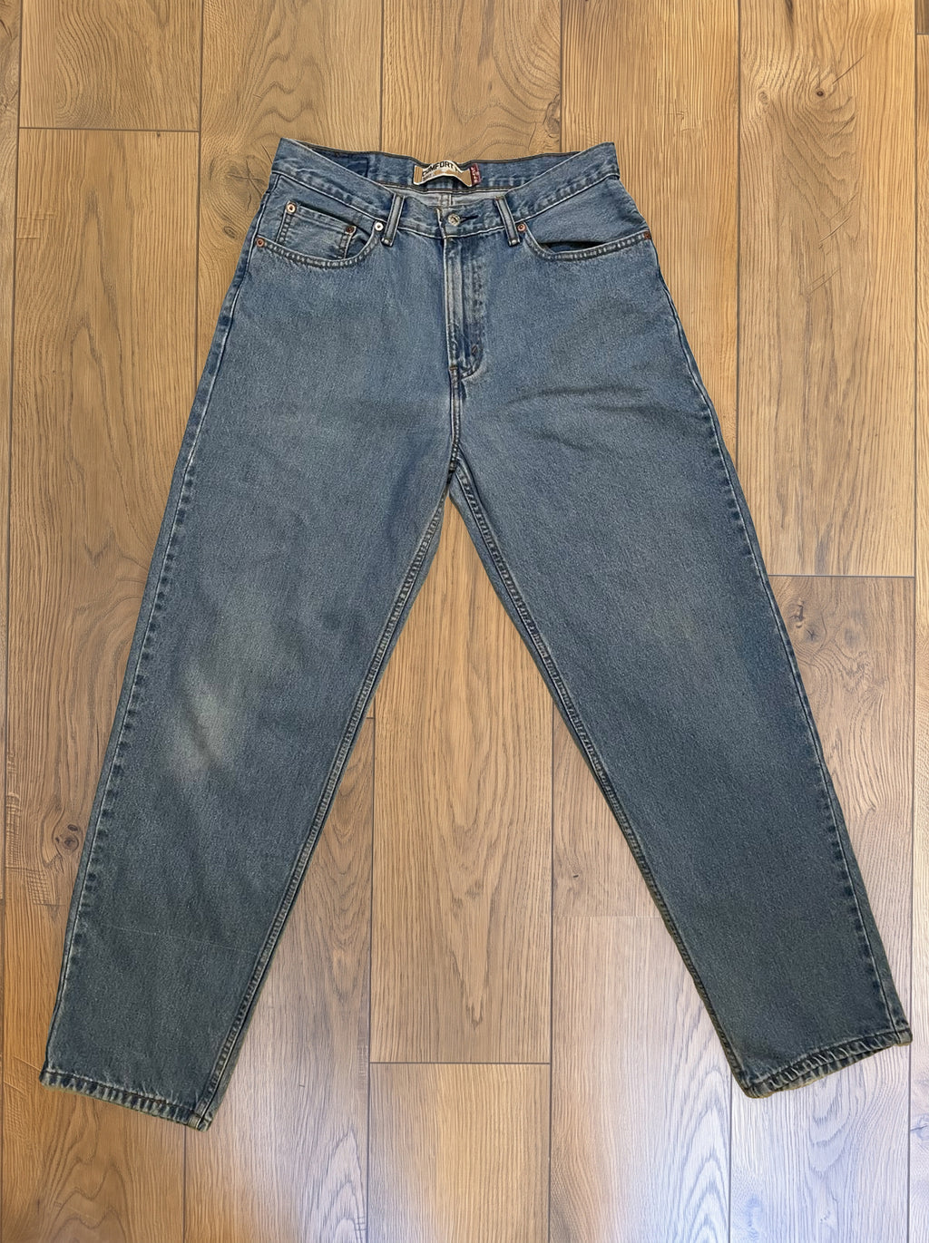 Vintage Levi's 560 jeans in light wash — detail