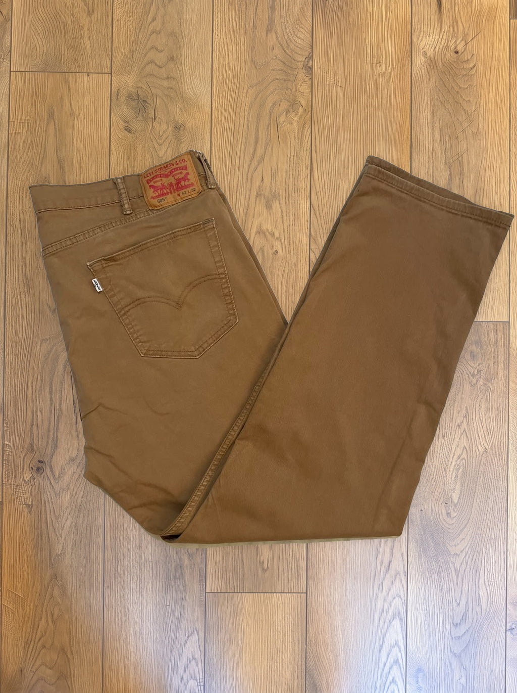 Vintage Levi's 505 jeans in tobacco brown — folded
